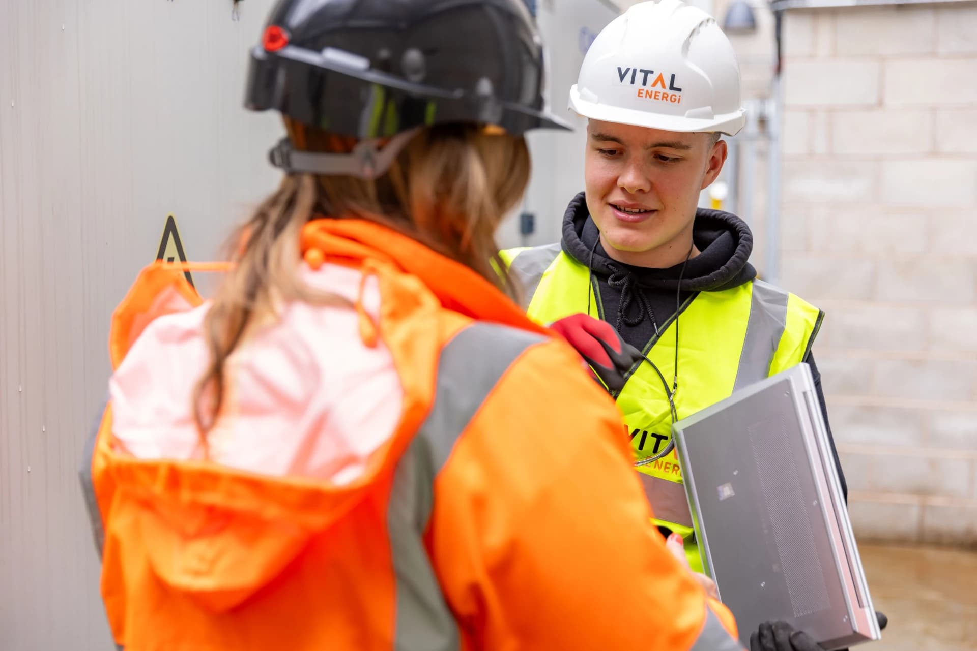 Young workers learning in a technical field setting