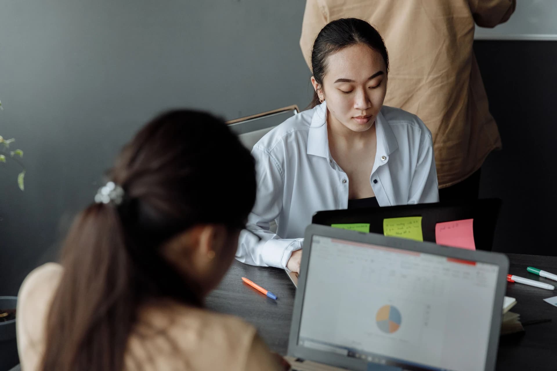 A young professional collaborating with an office team
